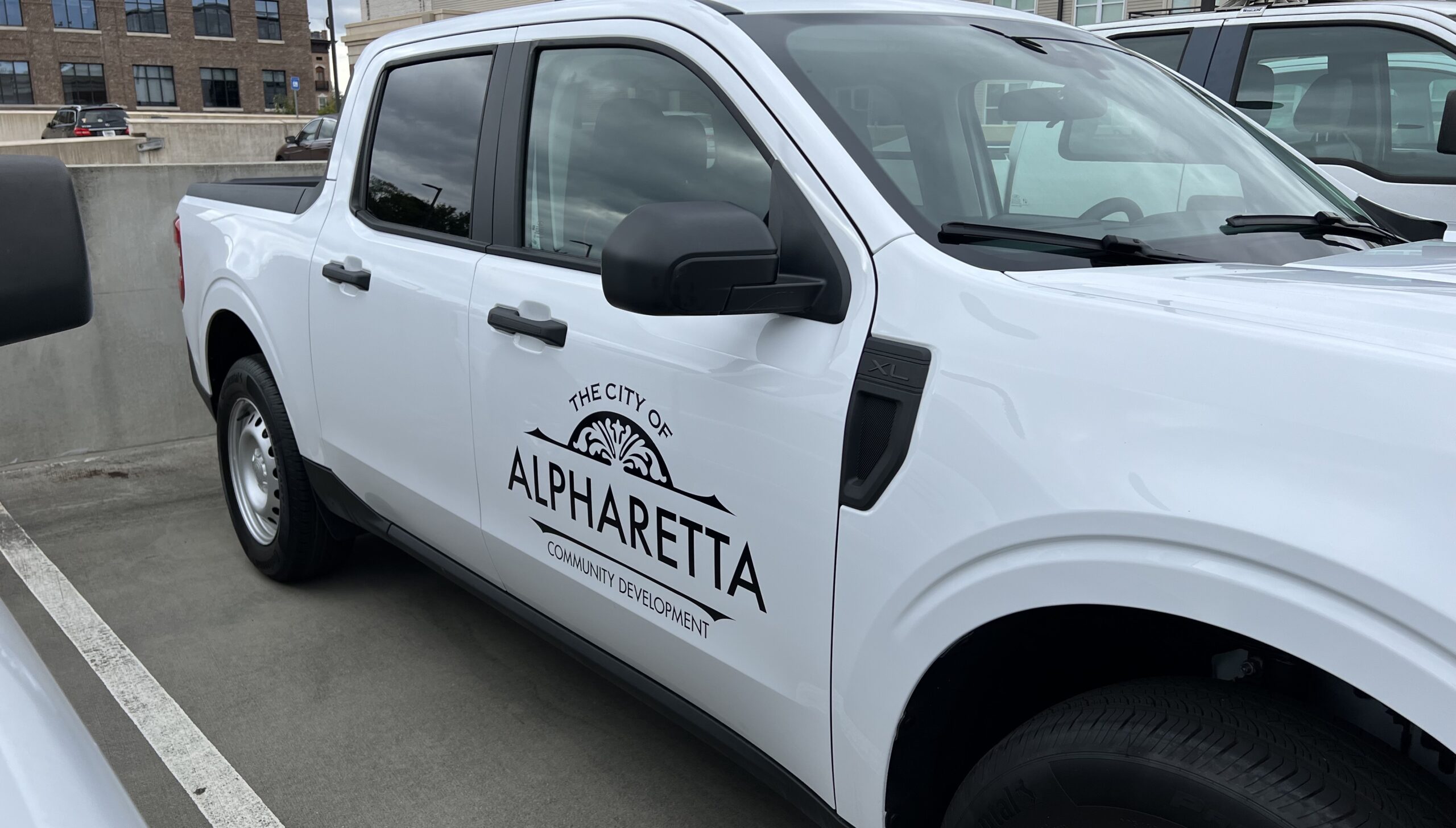 City of Alpharetta community development partial wraps and vinyl lettering for advertising on cars in Georgia